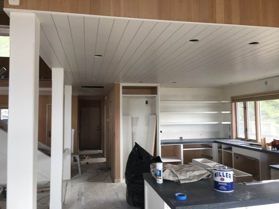 A kitchen with a bottle of kleenex on the counter