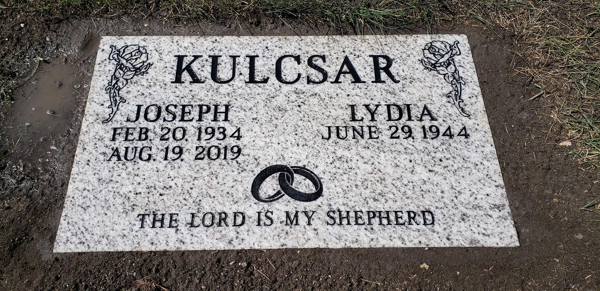 A gravestone with the words `` the lord is my shepherd '' written on it.