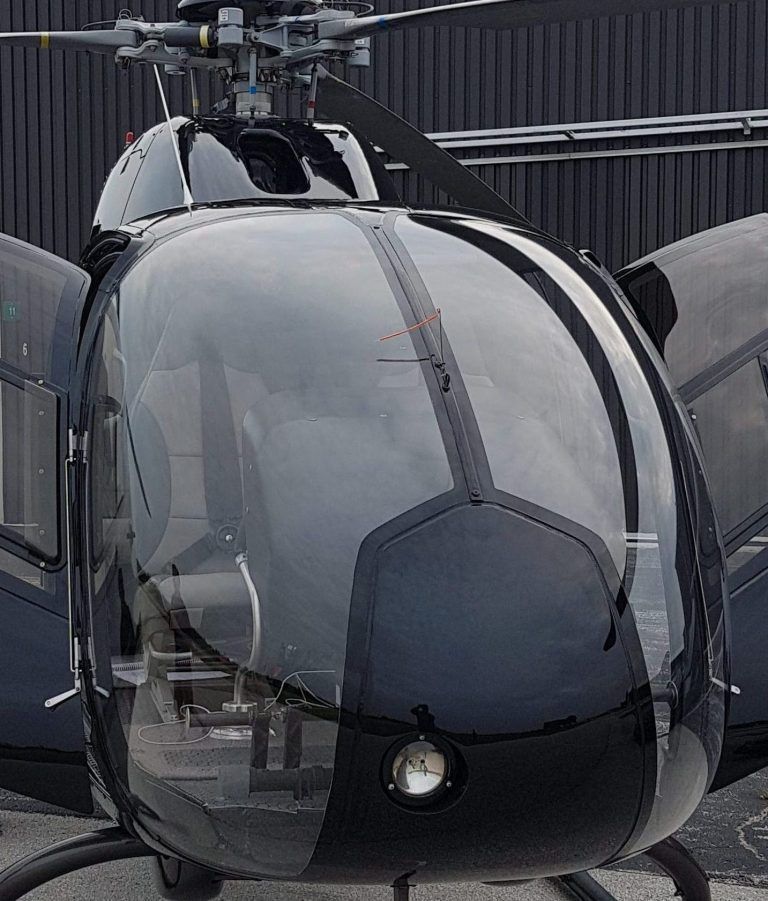 Black helicopter with transparent windows.