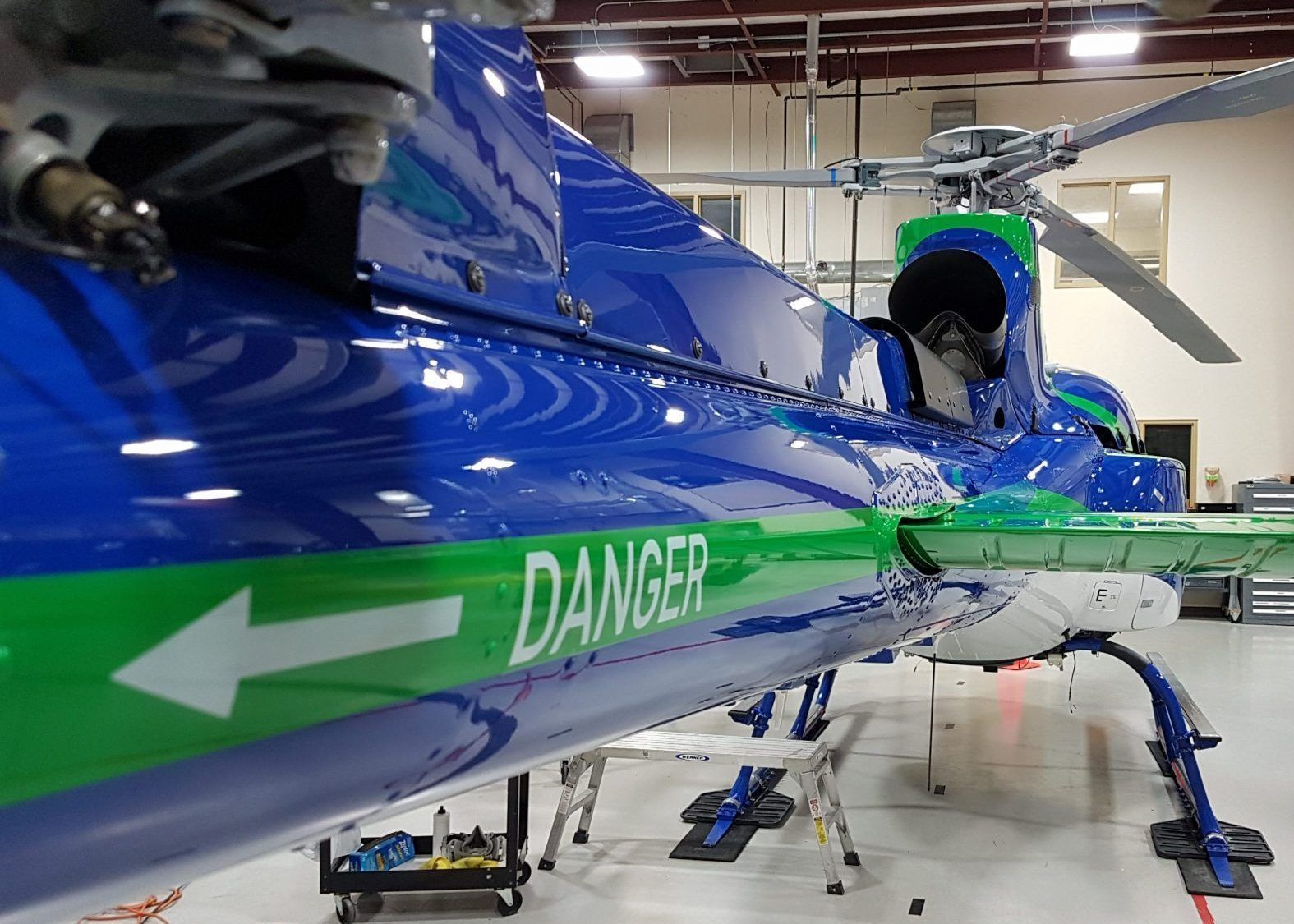 Blue and green helicopter with