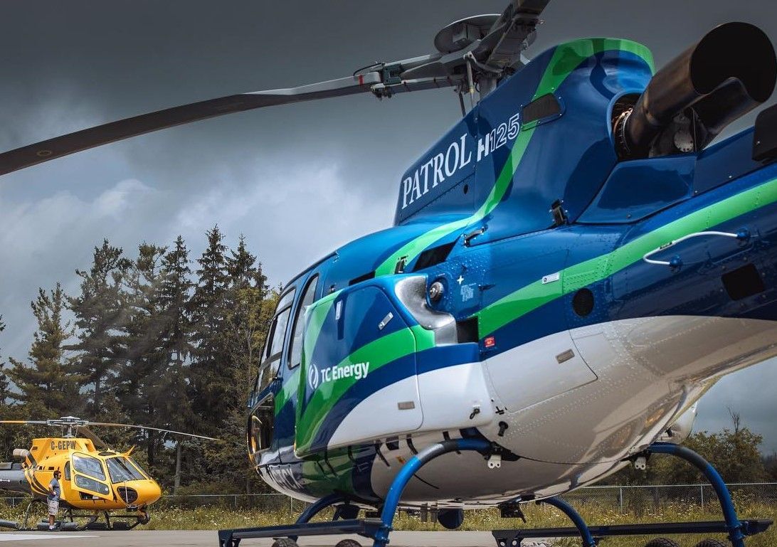 Blue and white helicopter labeled
