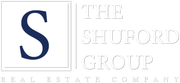 Logo for The Shuford Group Real Estate Company with a large blue “S” and white text