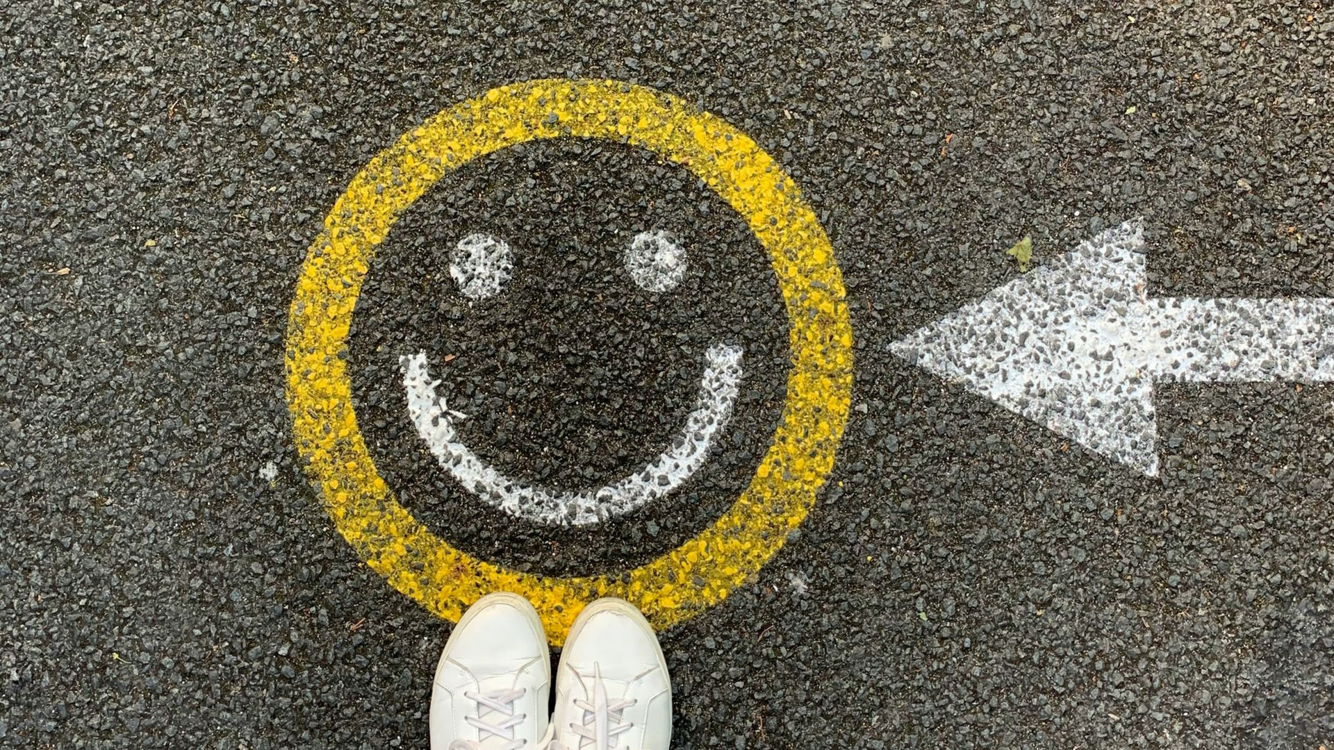 Photo of smiley face painted on street