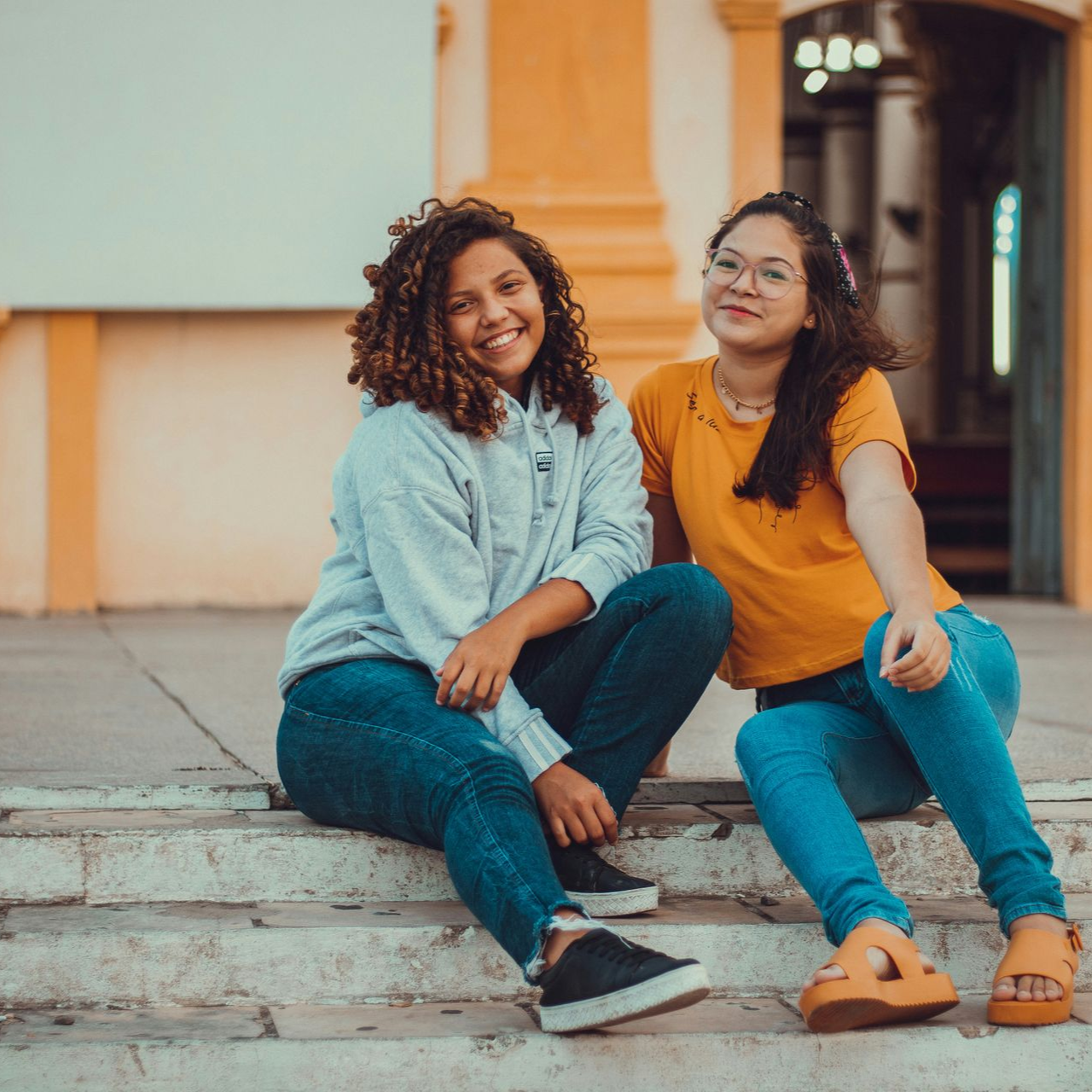 Photo of two teenage women smiling