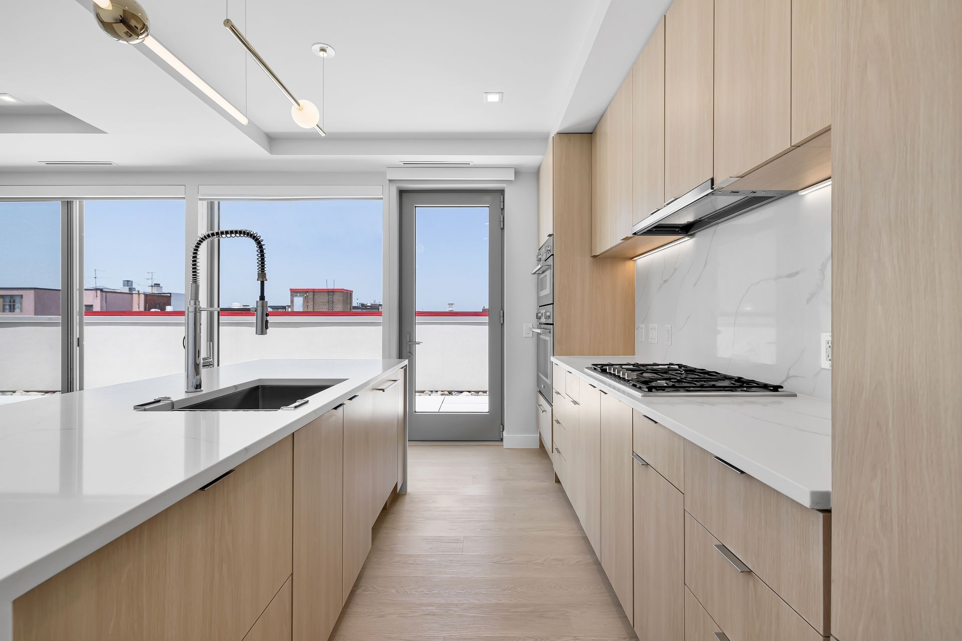 A kitchen with wooden cabinets and white counter tops