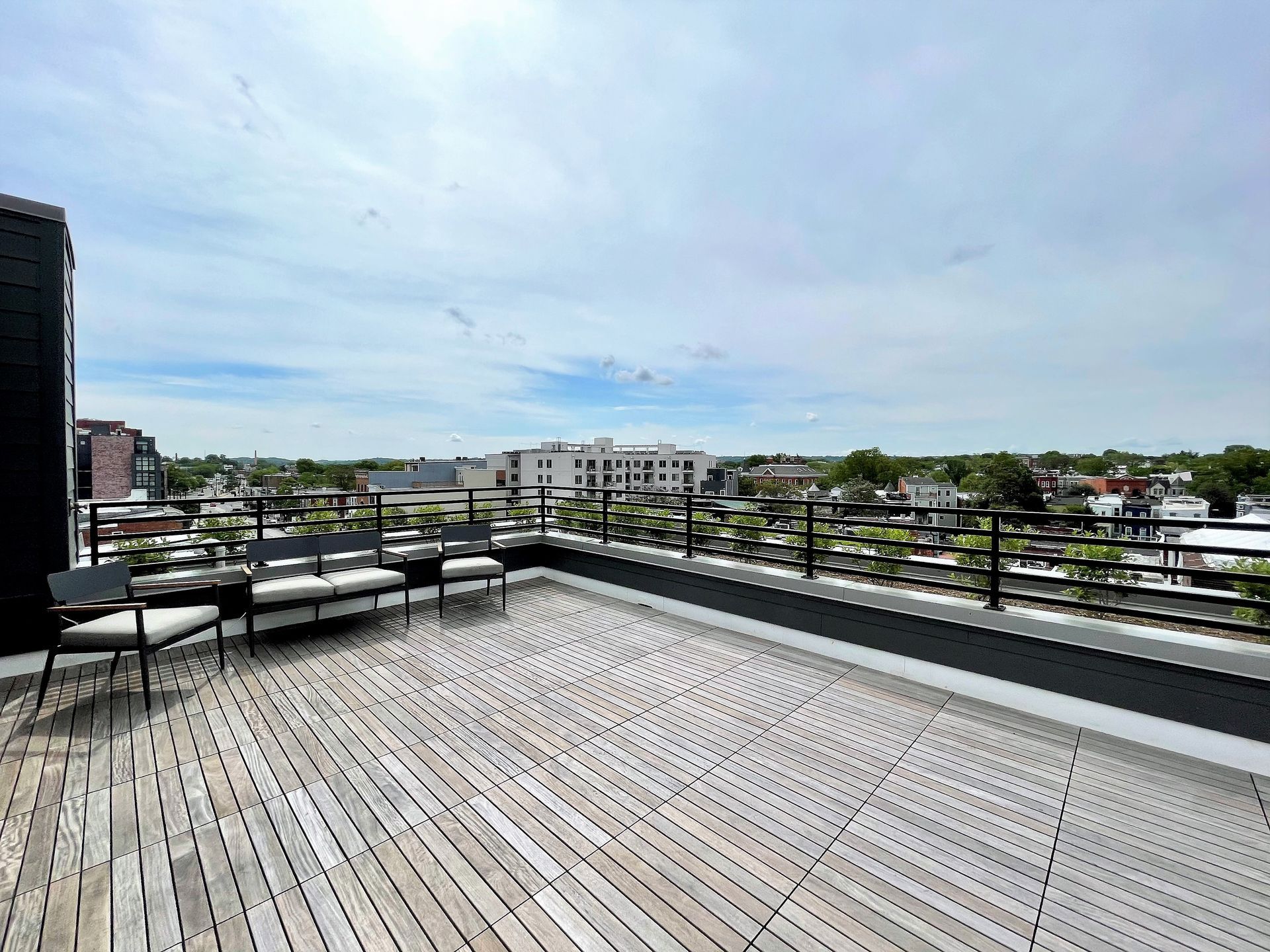There is a rooftop deck with a view of the city.