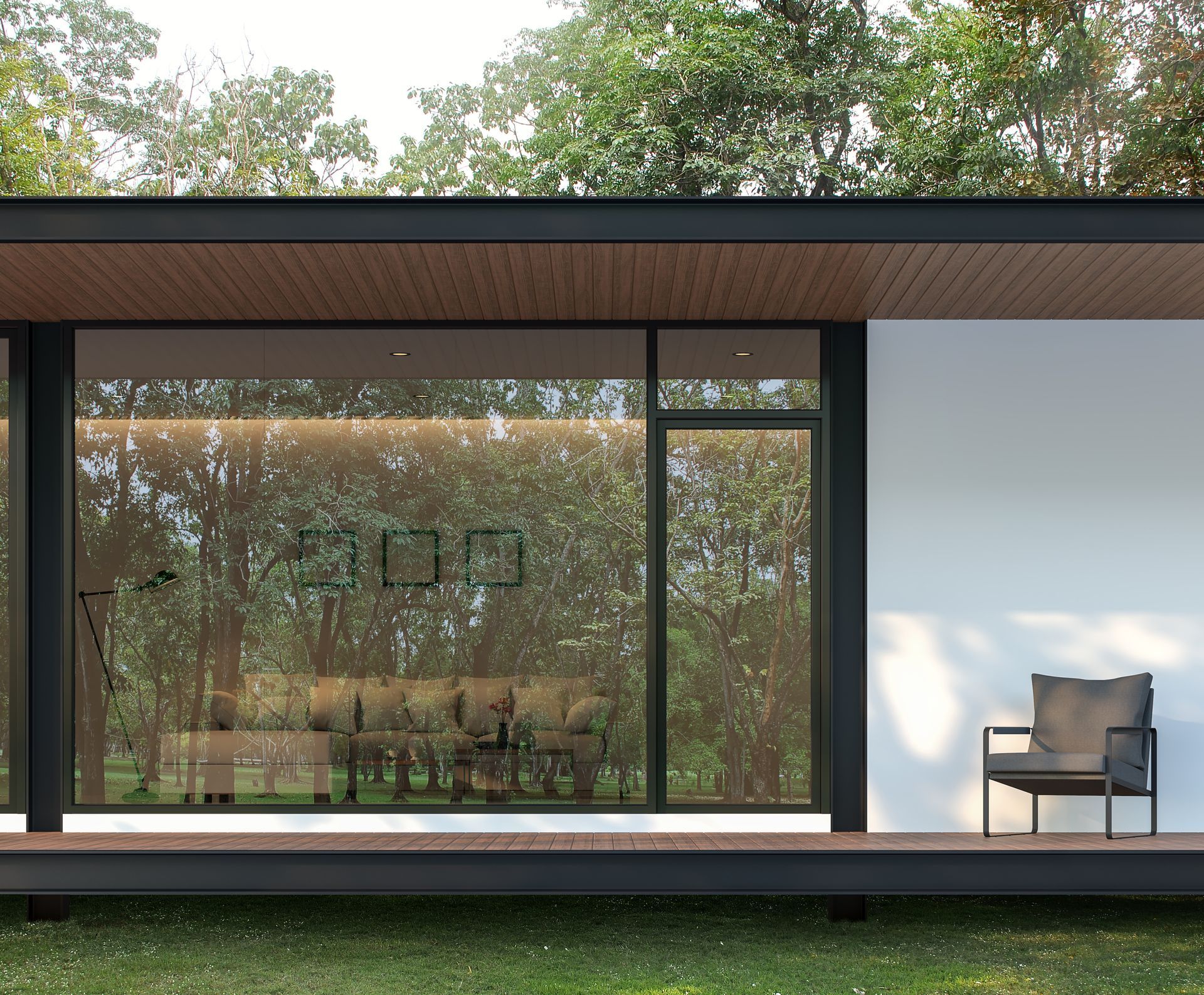 Modern building with large windows and a chair on a porch, surrounded by trees.