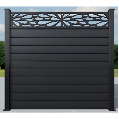 Dark gray metal privacy fence with decorative floral cutout panel on top
