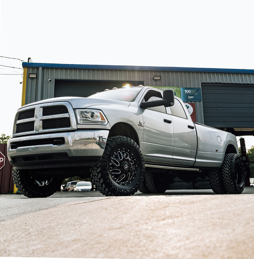 dark truck in front of shop | VM Automotive