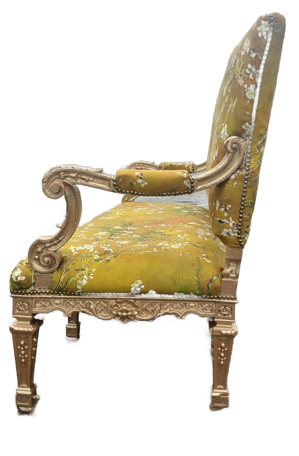 Gold-framed antique armchair with floral patterned olive green upholstery.