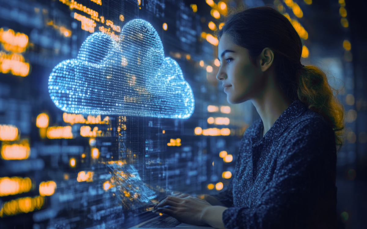 Woman looking at a glowing cloud-shaped display while using a laptop, set against a backdrop of digital information.