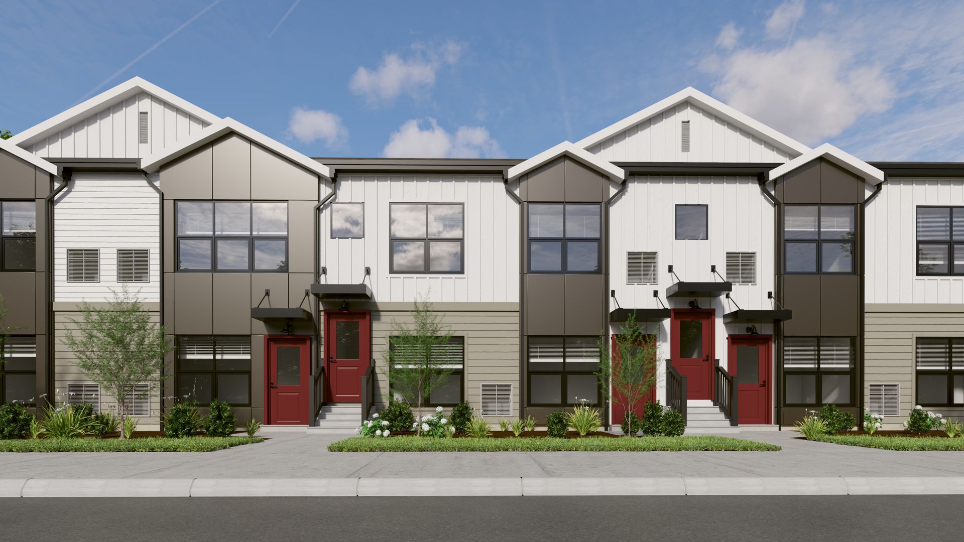 Modern two-story townhome complex with red doors, contrasting white and dark metal panels, and front landscaping.