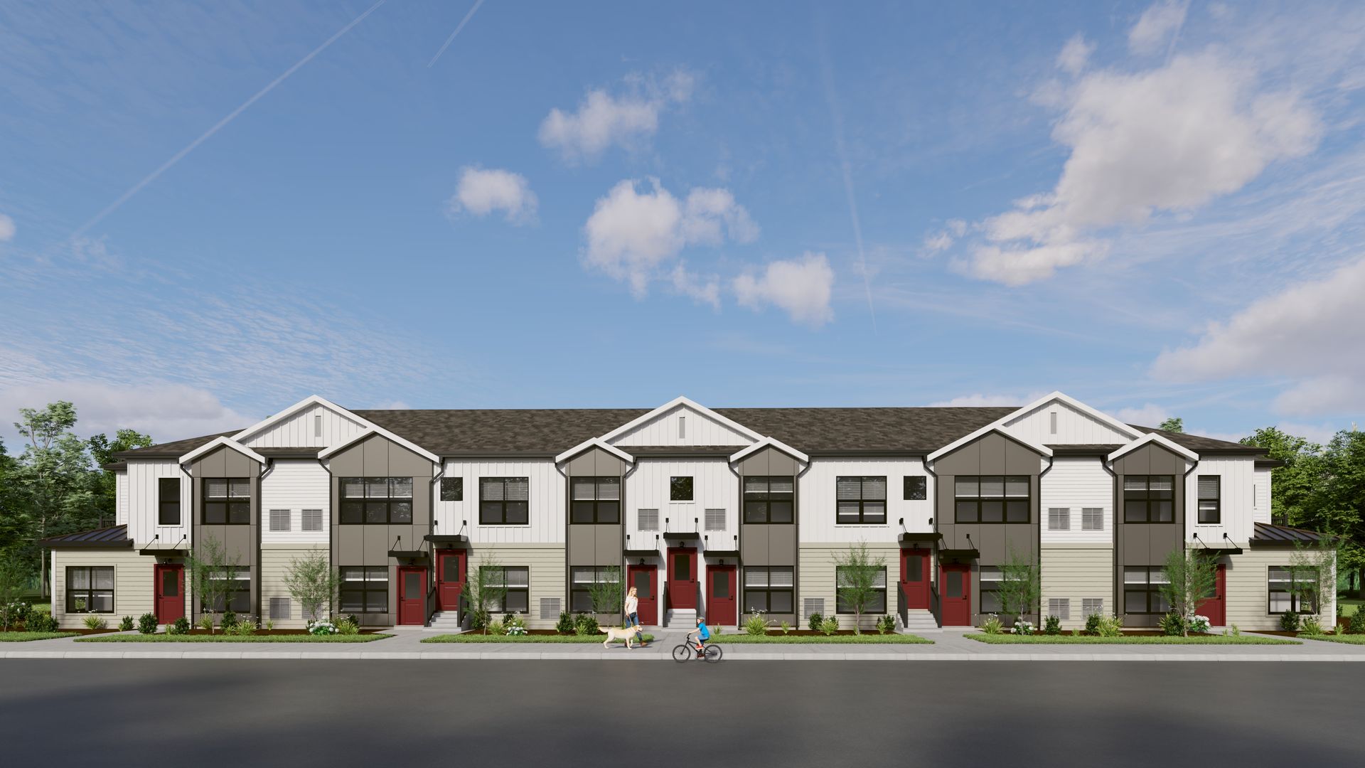 A multi-unit townhome complex with white and dark gray siding, featuring gabled roofs, red front doors, and landscaping.