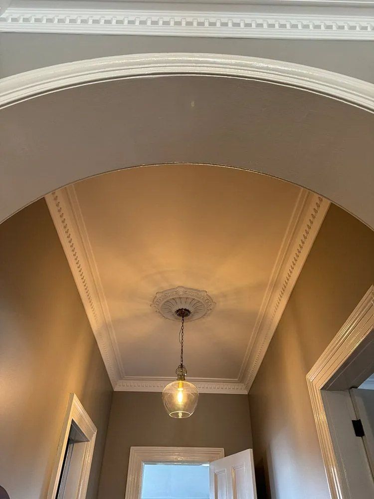 A Hallway With a Ceiling Light Hanging From It — Chandolin Construction in Bathurst, NSW