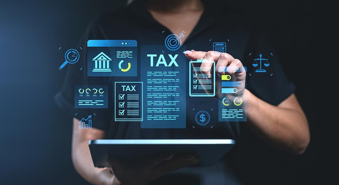 Person using tablet with digital tax forms and icons overlaid.