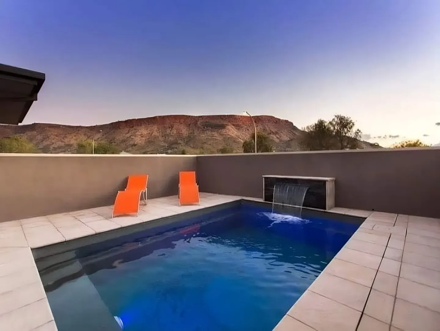 A Pool With A Mountain In The Background — Burton Group In Ciccone, NT