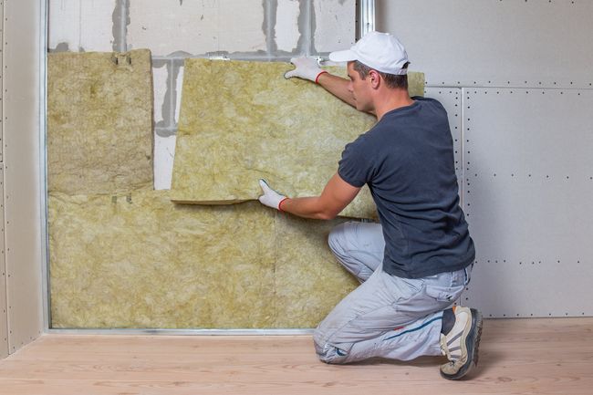 insulation installer with PPE on