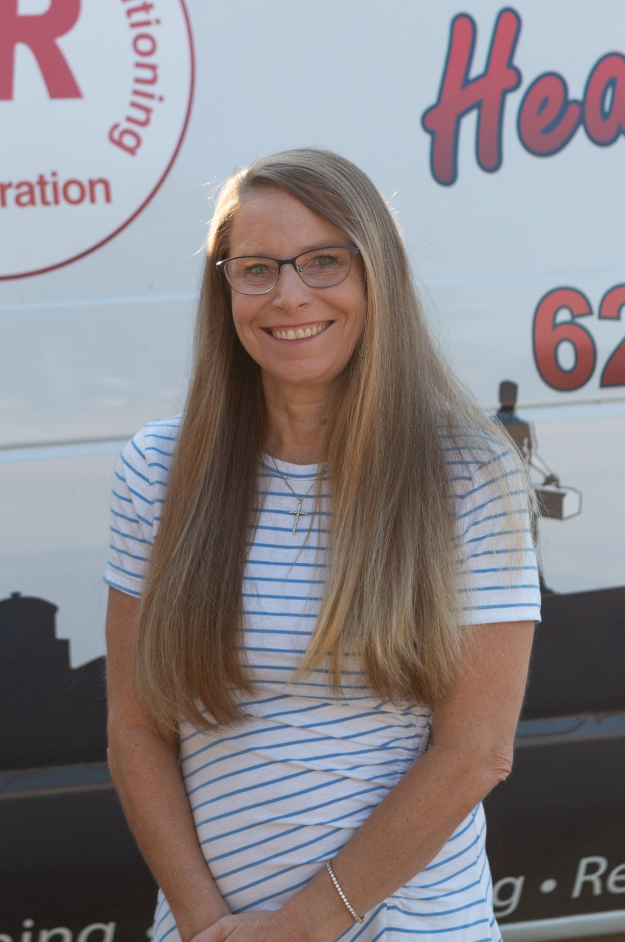 deanna standing in front of city plumbing van