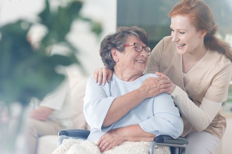 Nurse comforting and supporting senior woman Nurse comforting and supporting senior woman