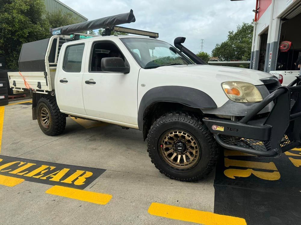 White Vehicle With New Tyres