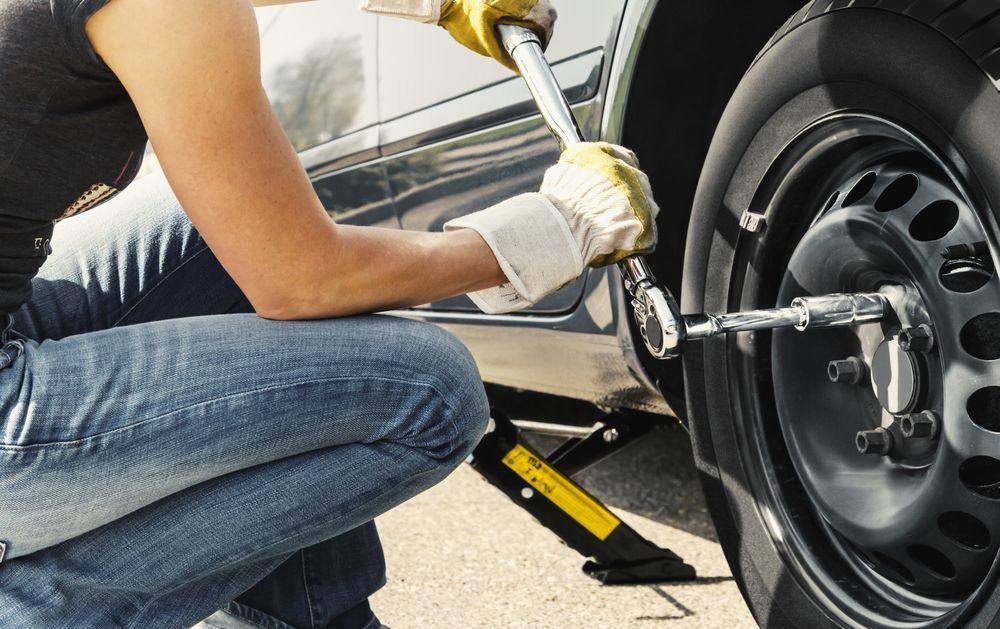Woman Changing Tyre