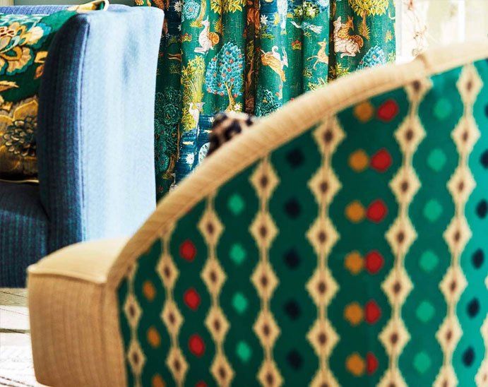 green fabric-backed armchair