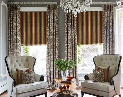 A regal living room with two matching armchairs