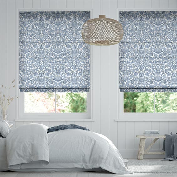 Grey and white floral patterned blinds in a bedroom