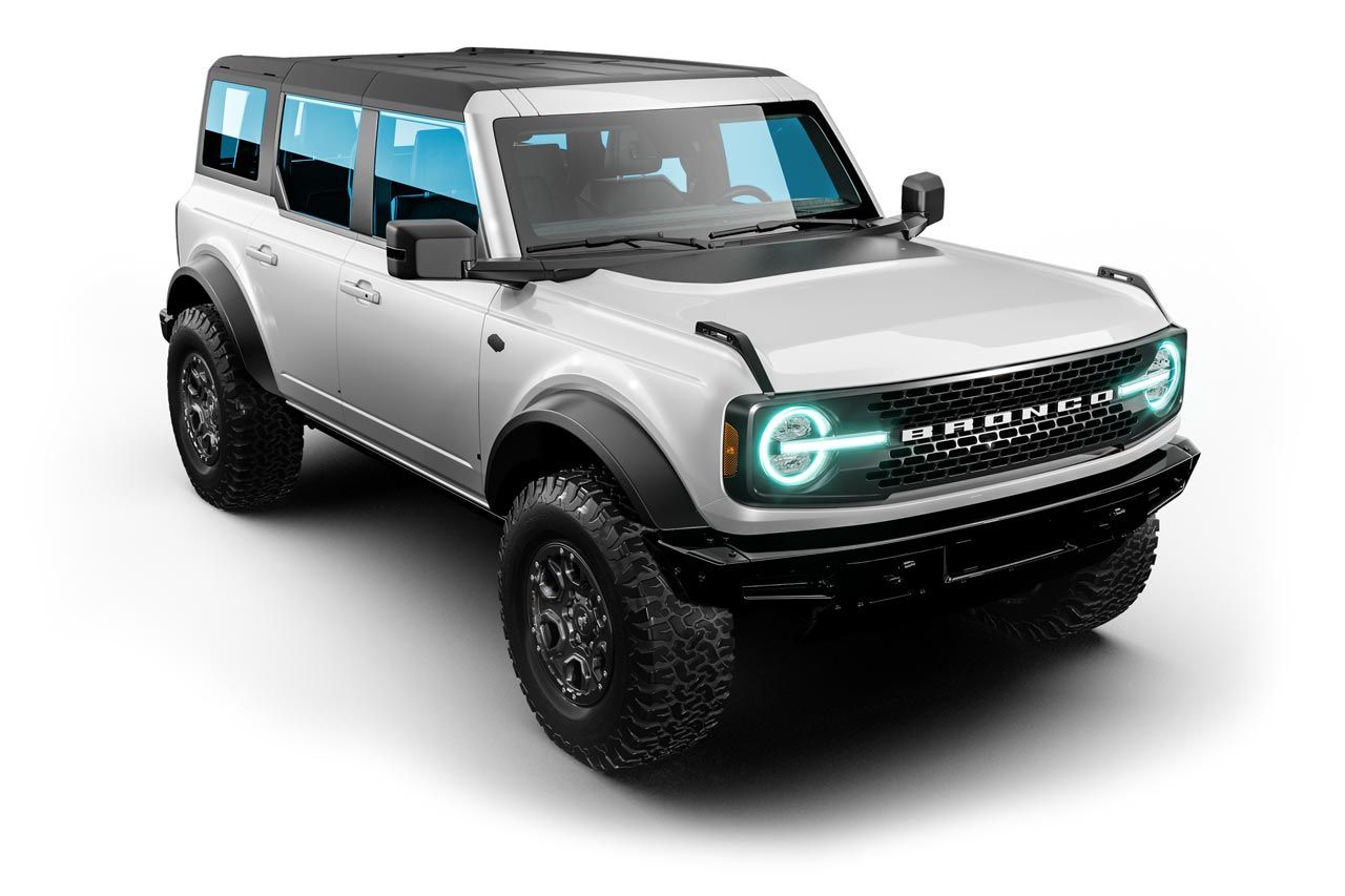 White Ford Bronco SUV with black accents, black wheels, and tinted windows.