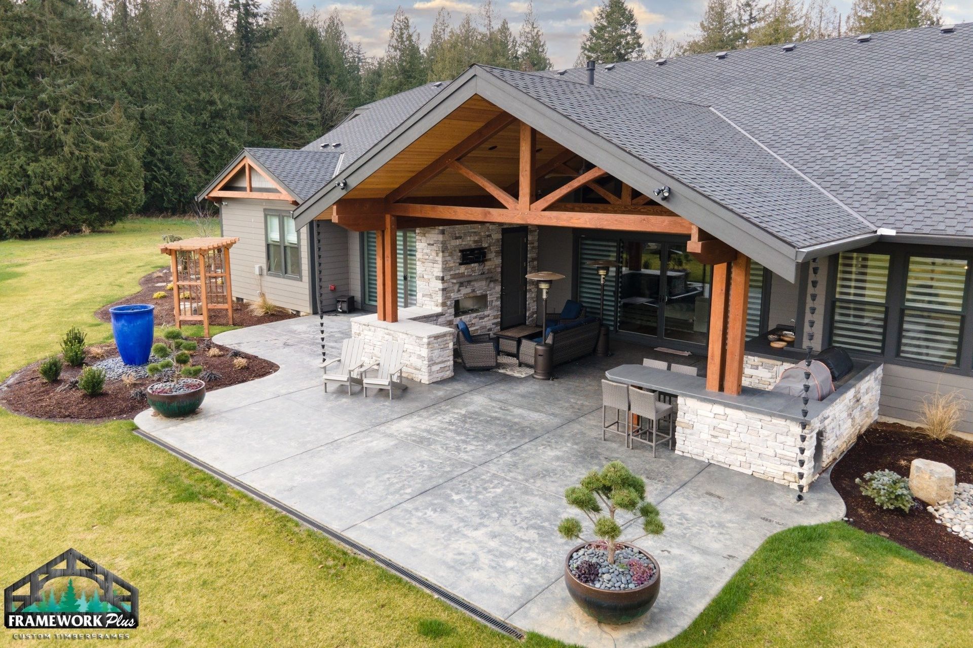 A large house with a covered patio in front of it.
