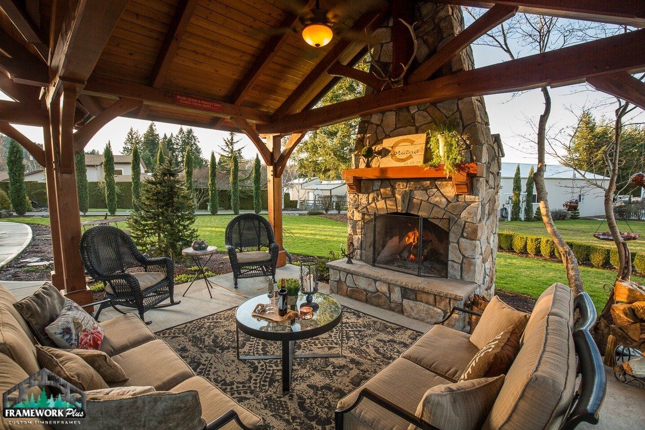 There is a fireplace in the middle of the patio area.