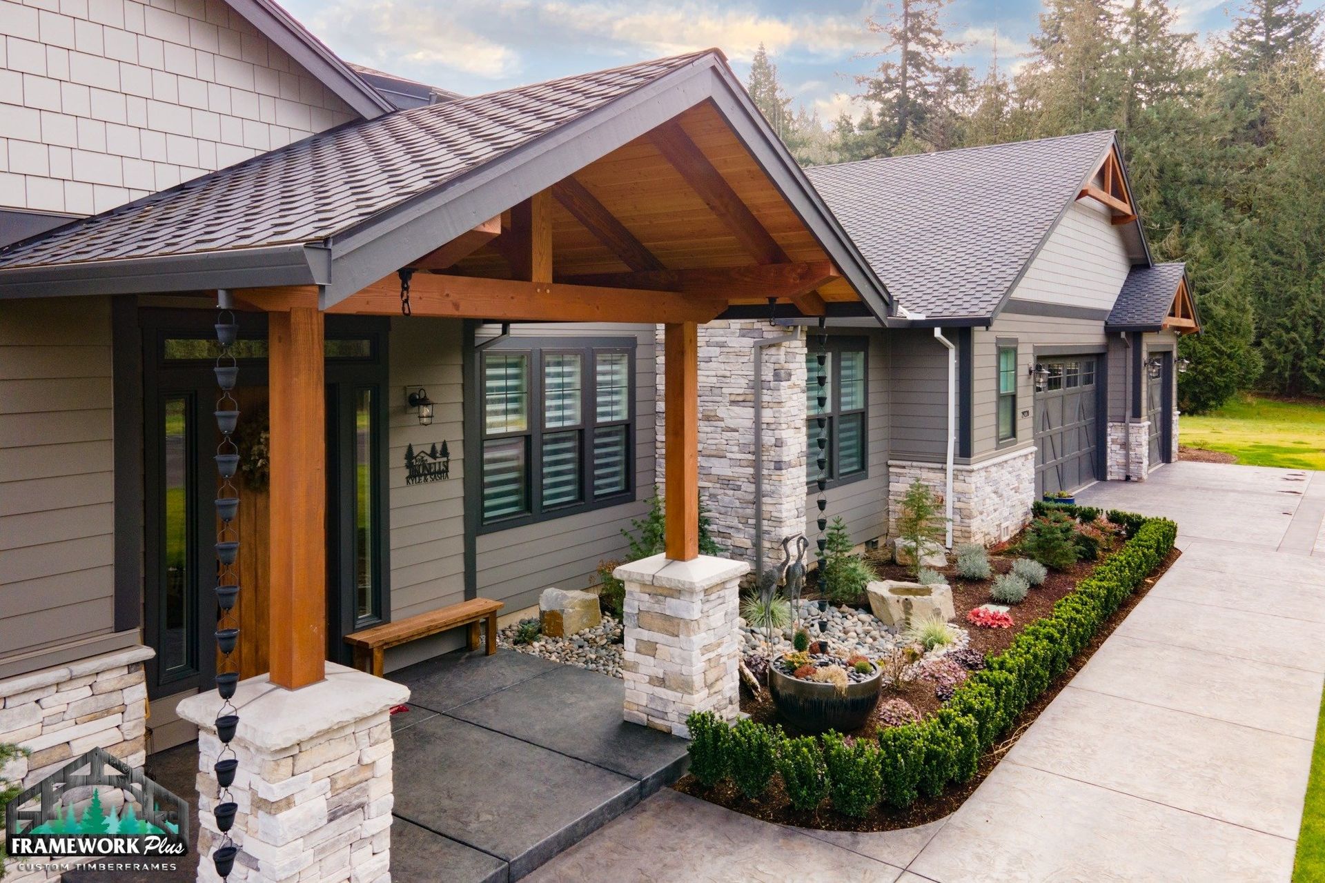 A large house with a covered porch and a stone walkway