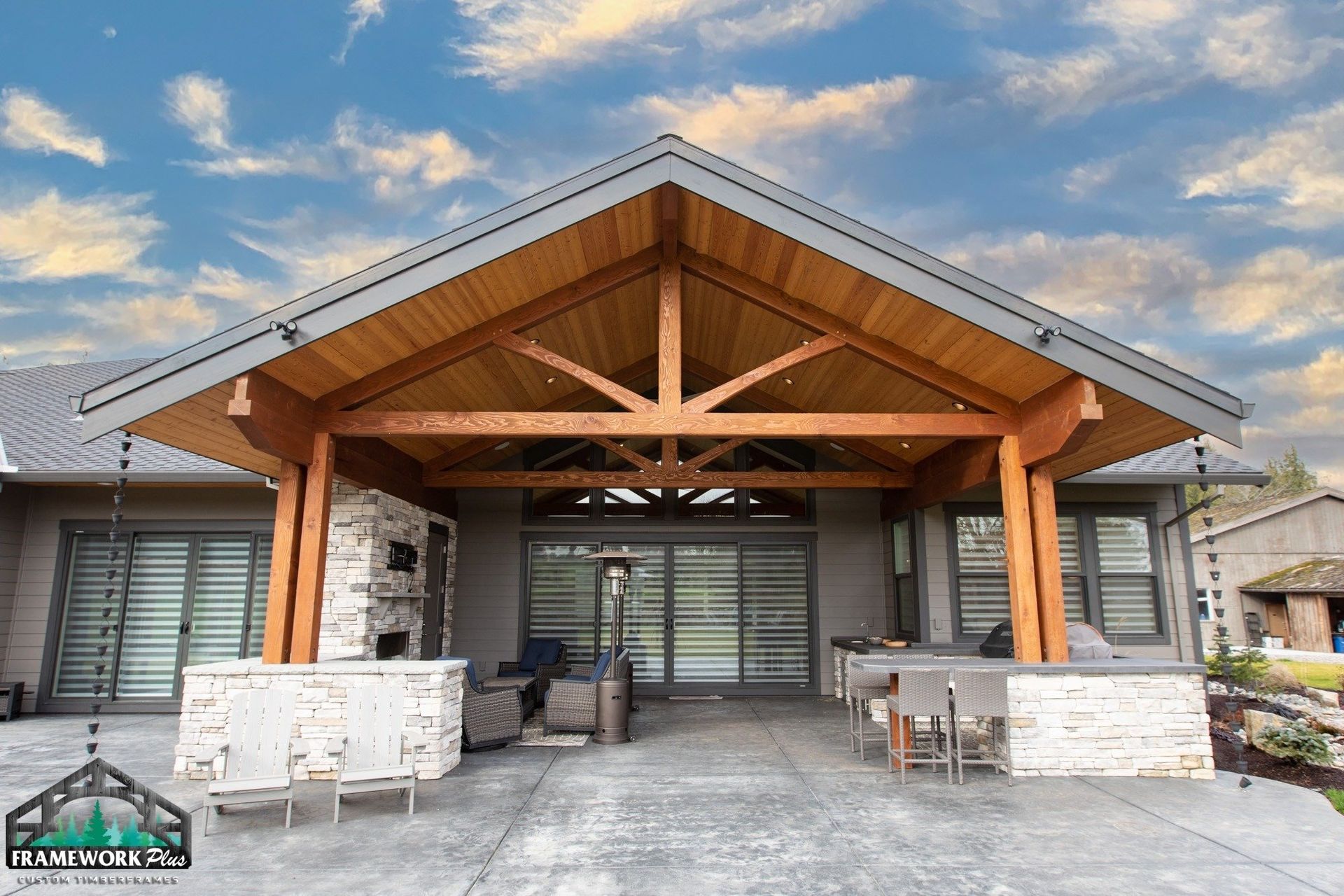 A house with a wooden roof and a patio area
