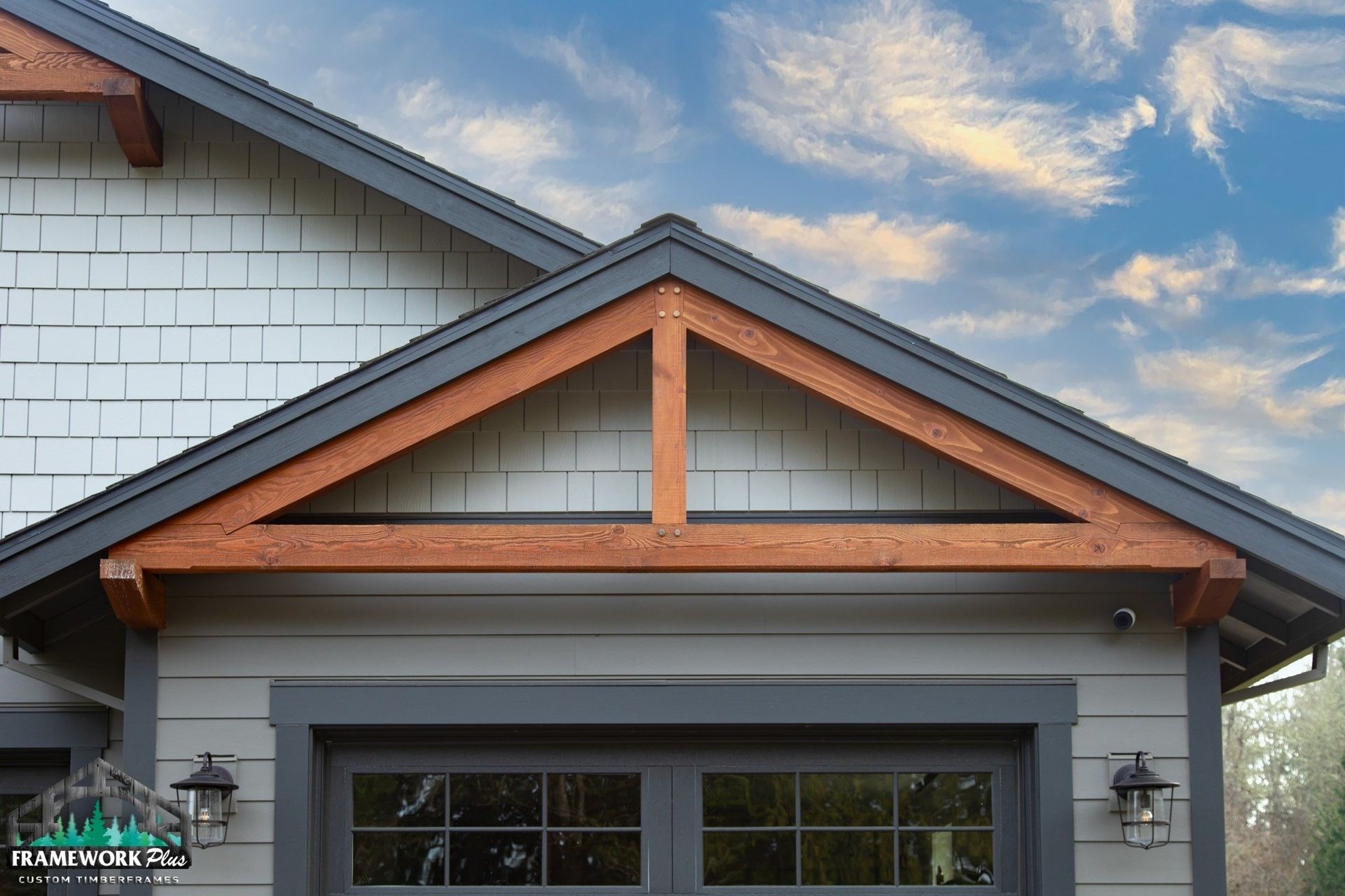 A house with a wooden roof and a garage door