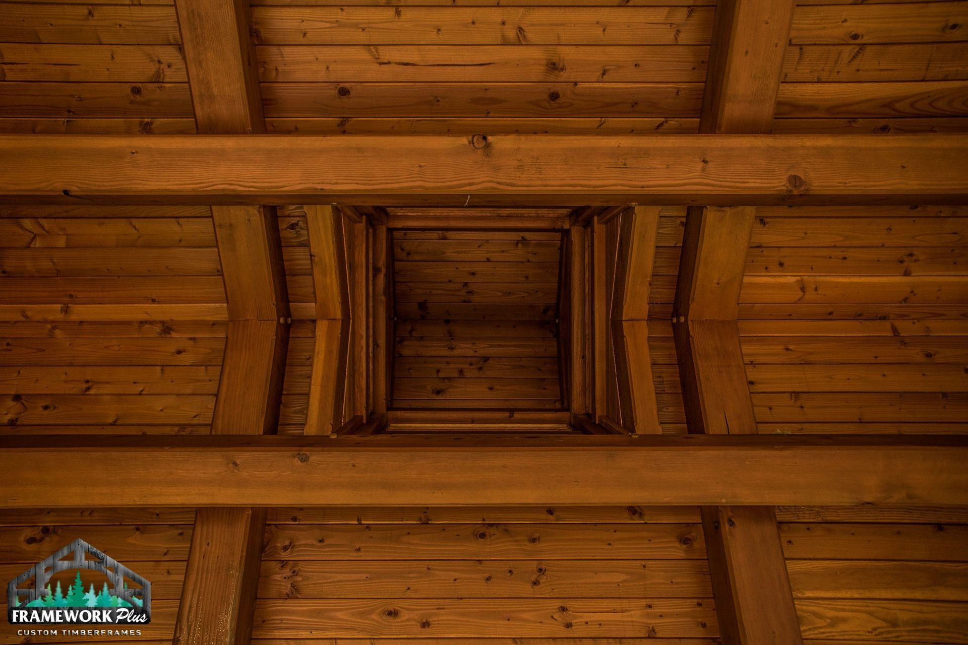 Looking up at the ceiling of a wooden building.