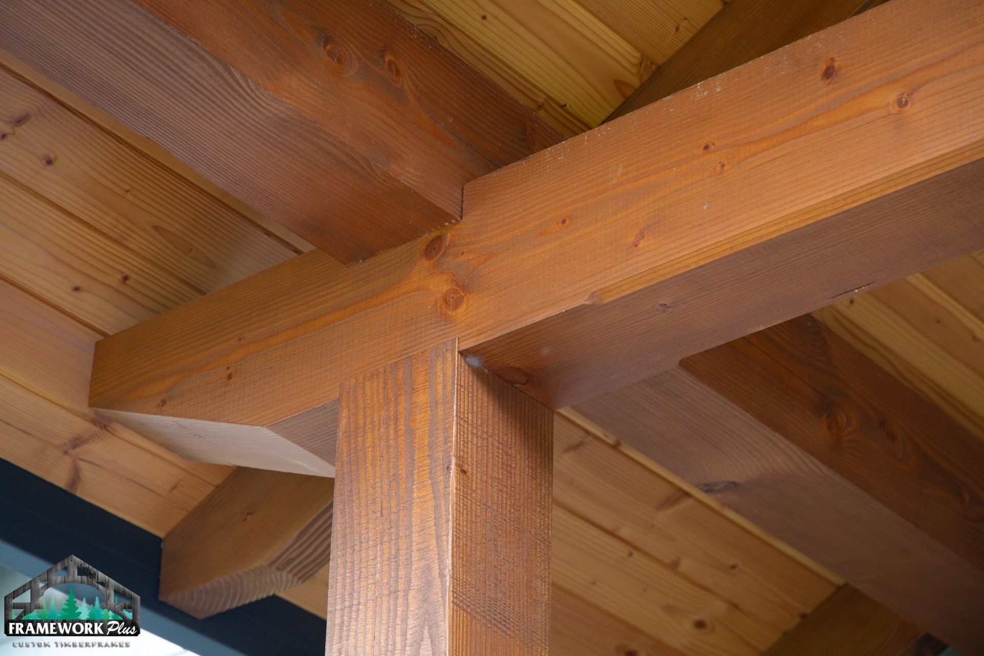 A close up of a wooden structure with a roof.