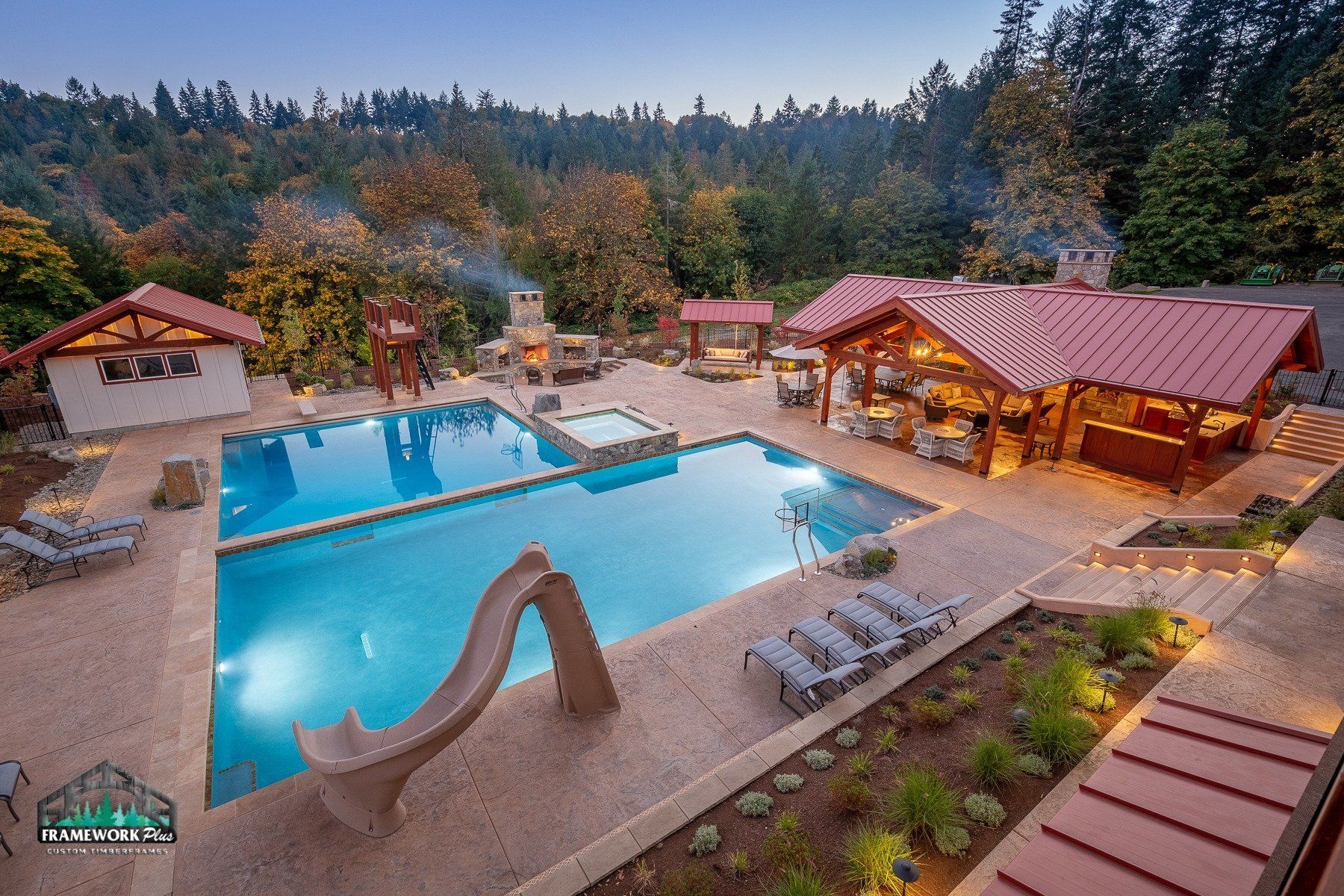 An aerial view of a large swimming pool with a slide.