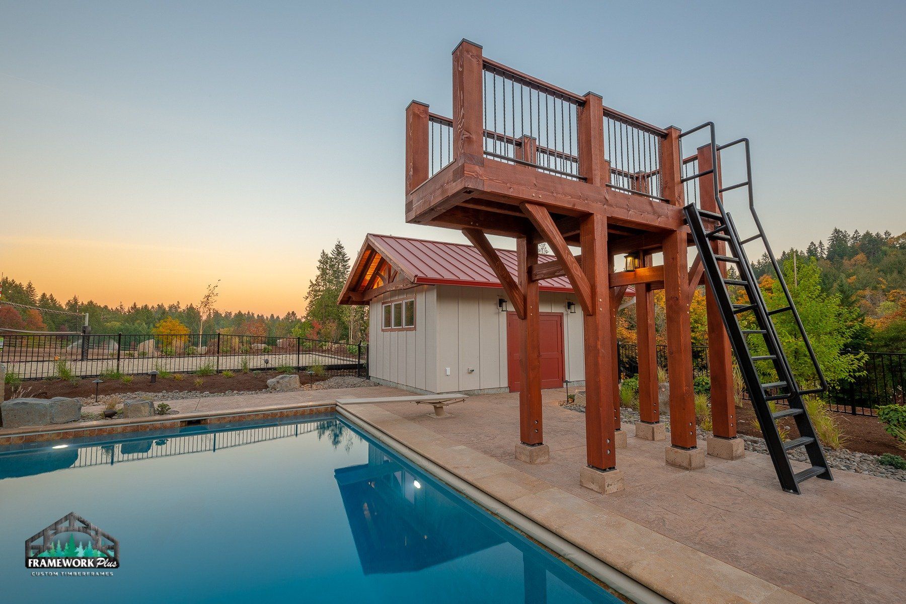 A swimming pool with a wooden deck and stairs