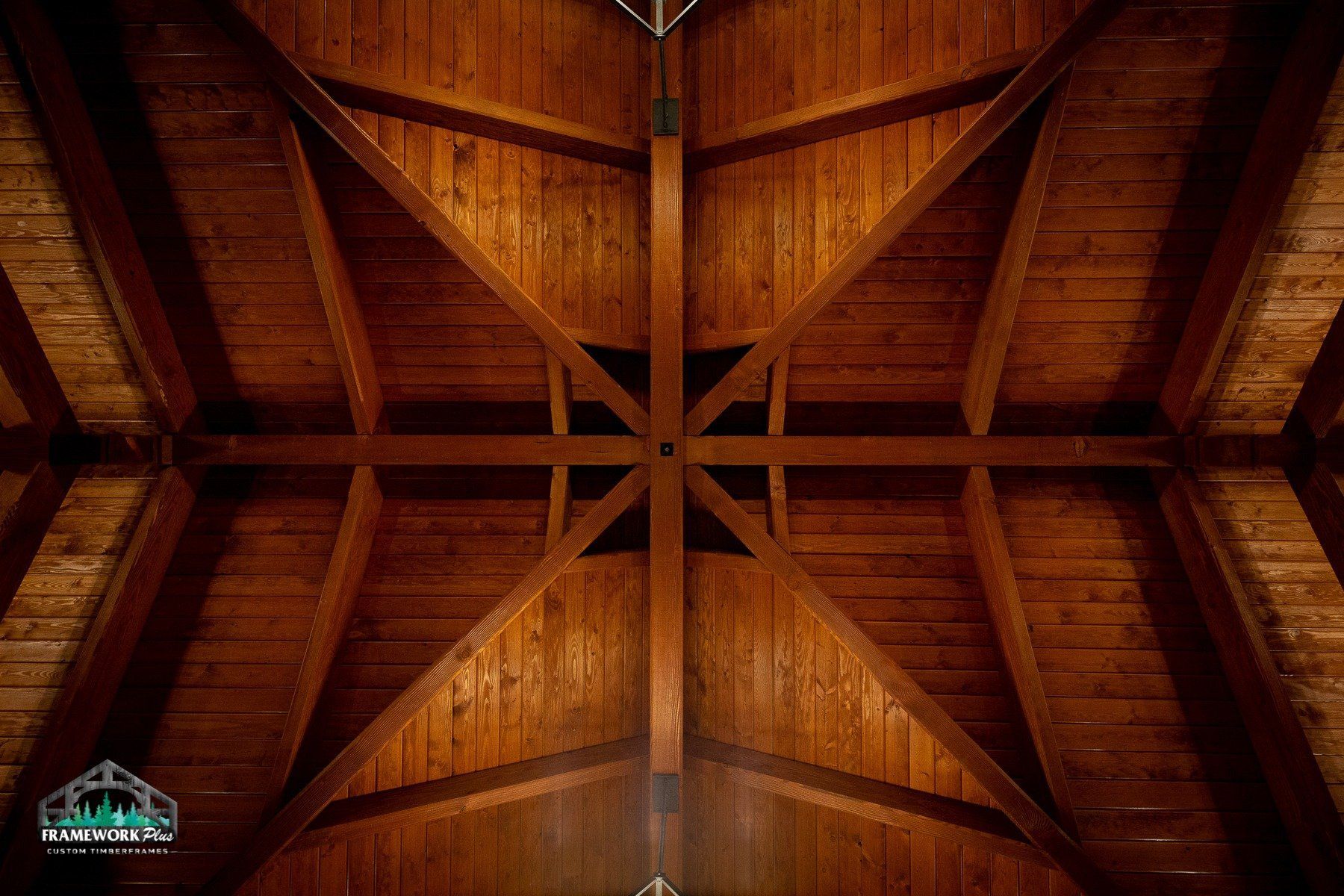 Looking up at the ceiling of a wooden building.