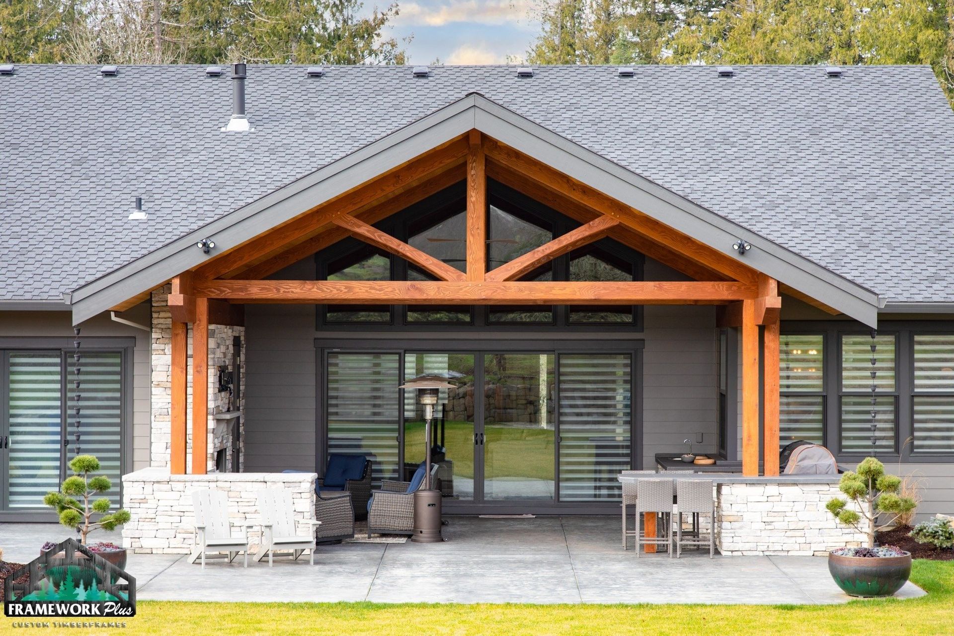 A house with a gray roof and a wooden porch.