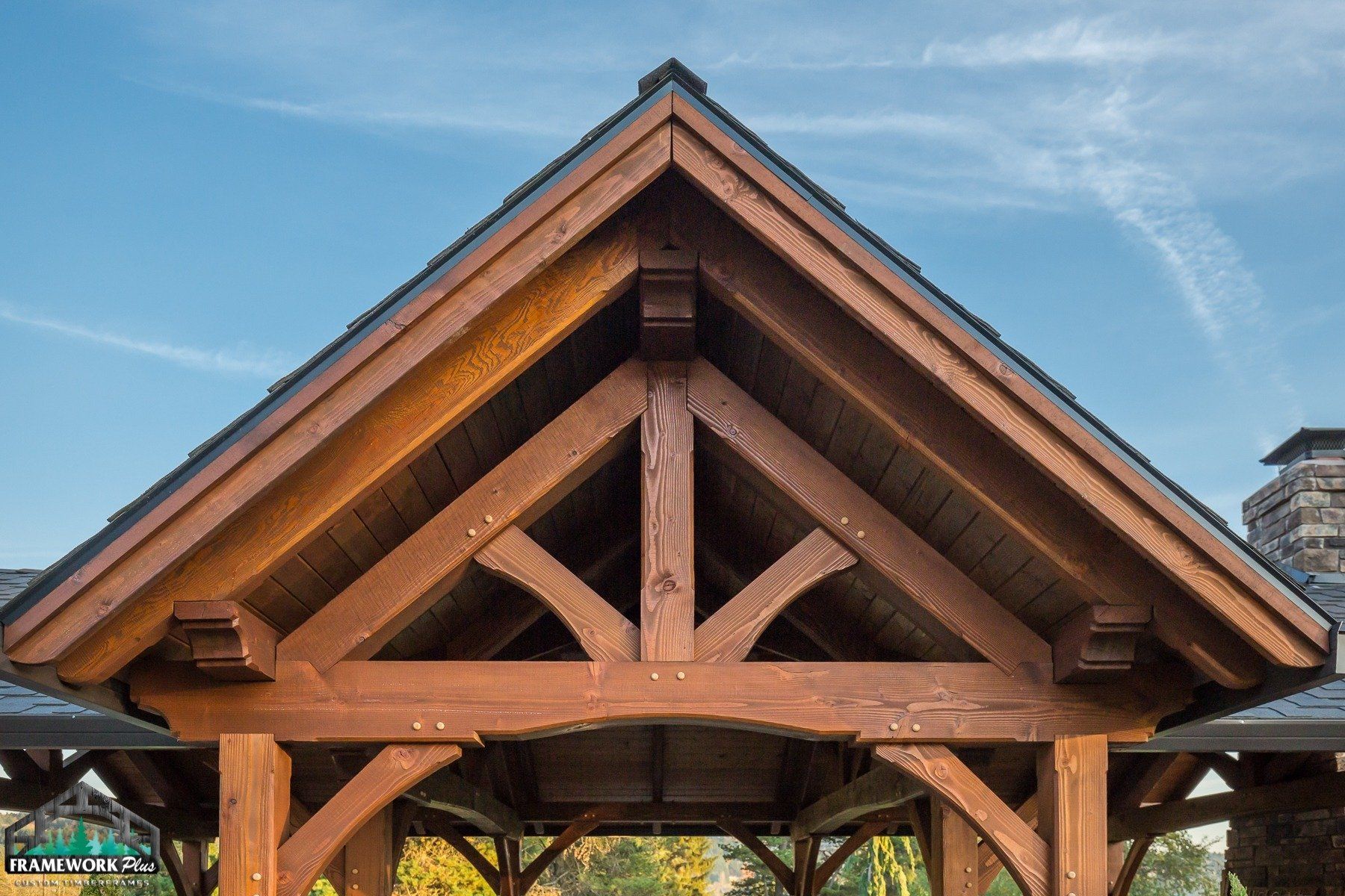 The roof of a wooden structure with a slate roof.