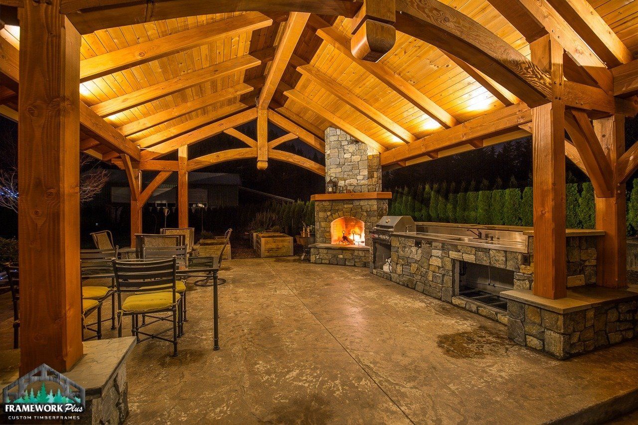 There is a fireplace in the middle of the patio area.