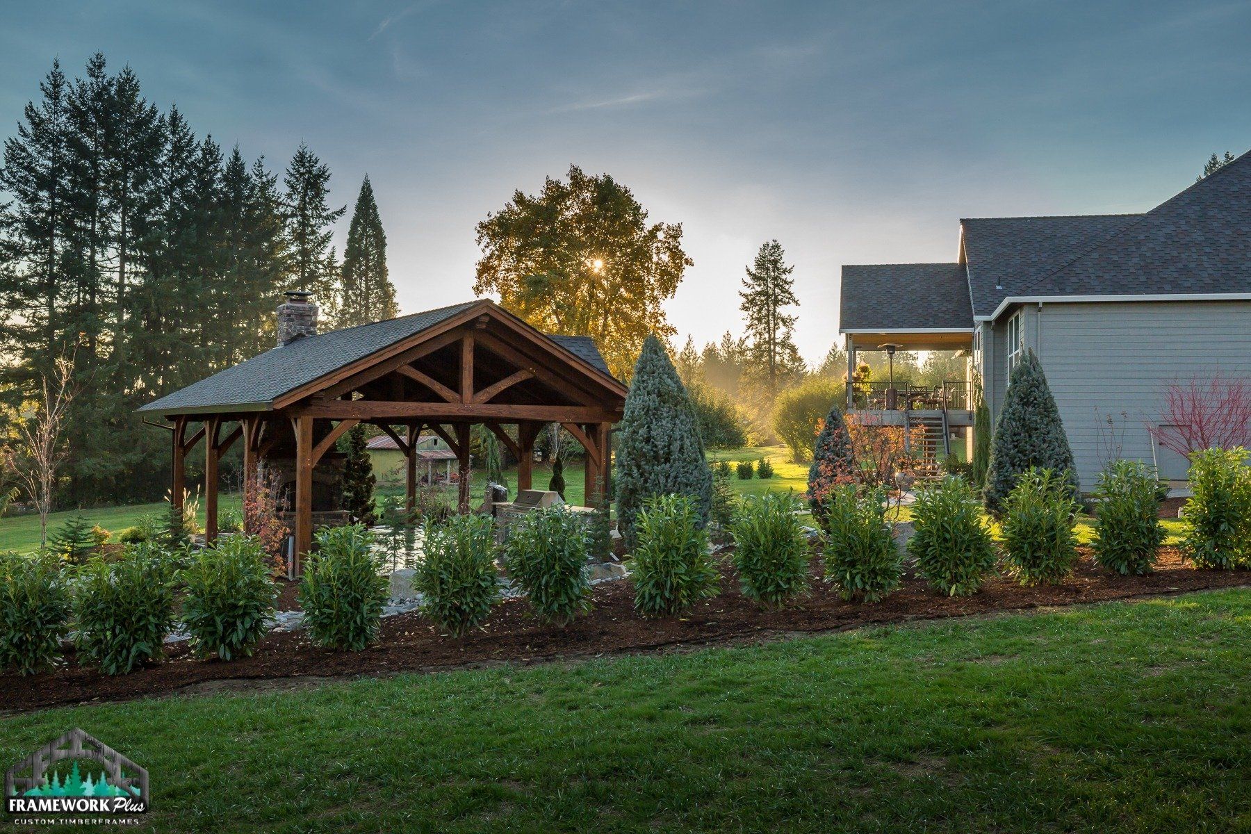 There is a gazebo in the backyard of a house.