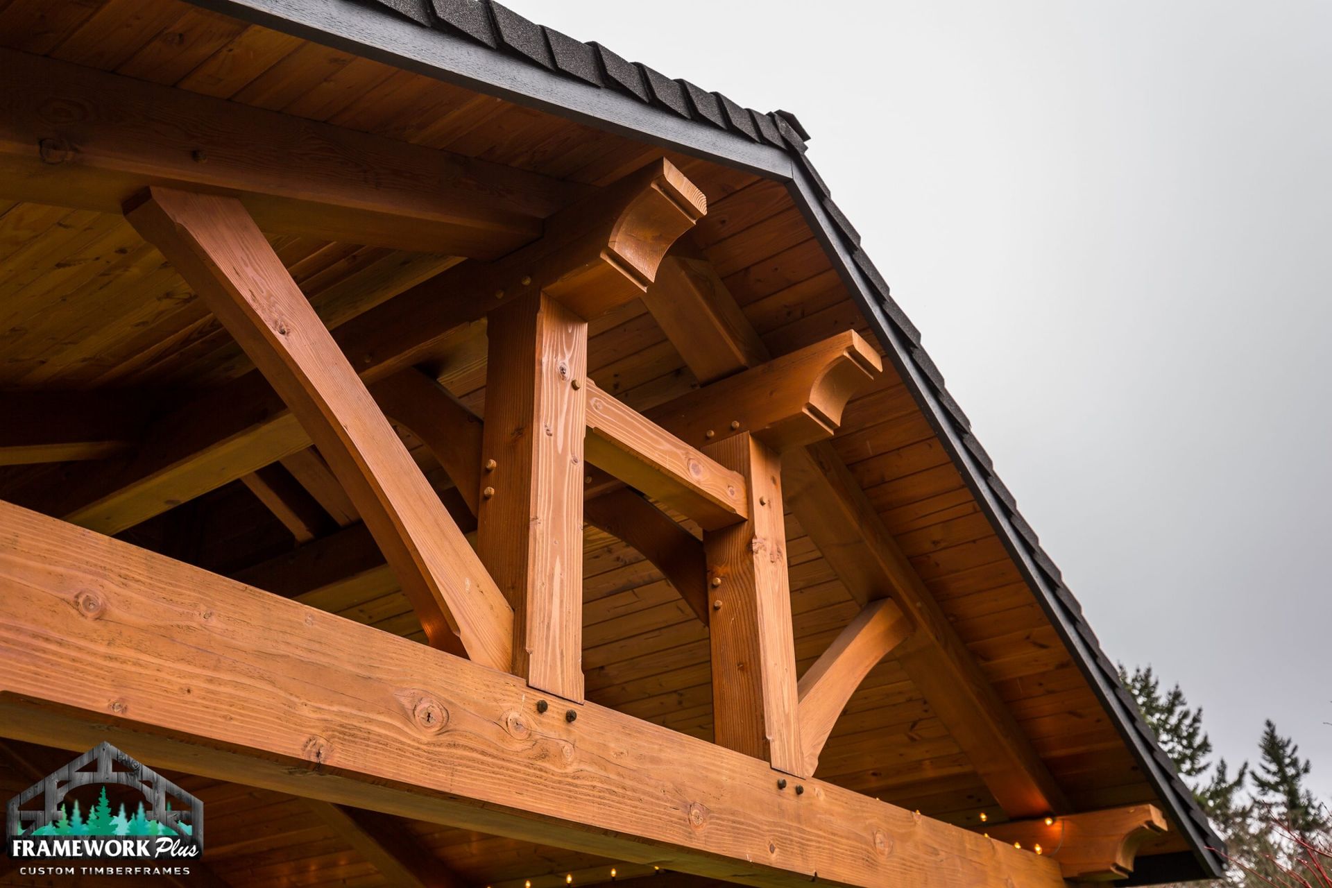 A close up of a wooden roof with lights on it