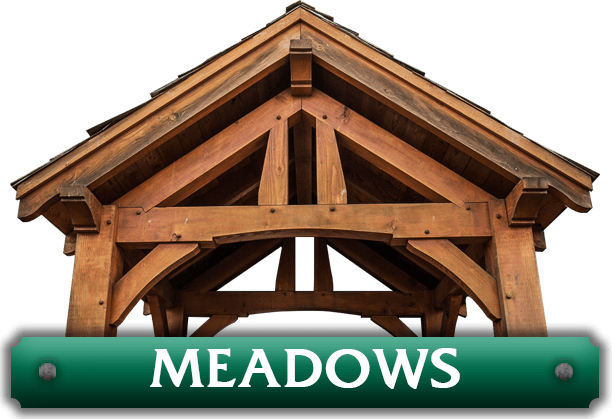 A green sign that says meadows on it