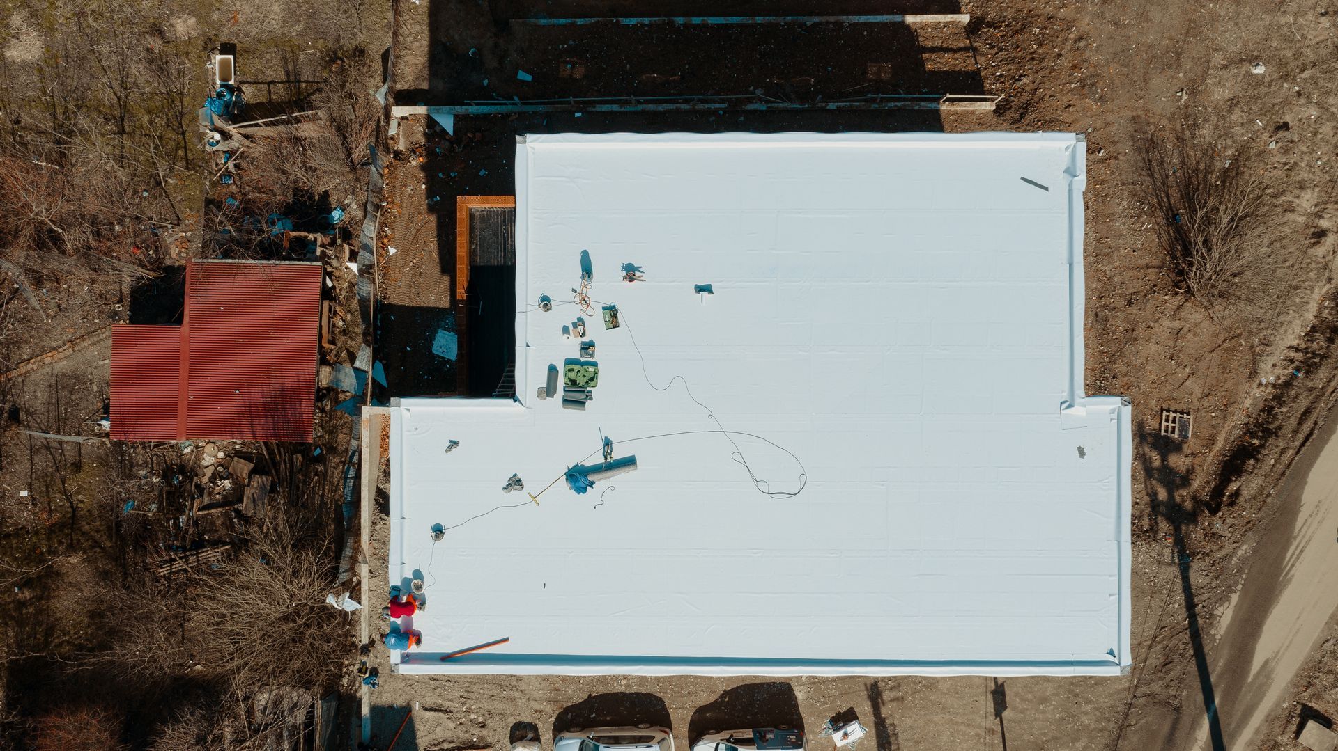 Aerial view of a flat roof project by commercial roofing services.
