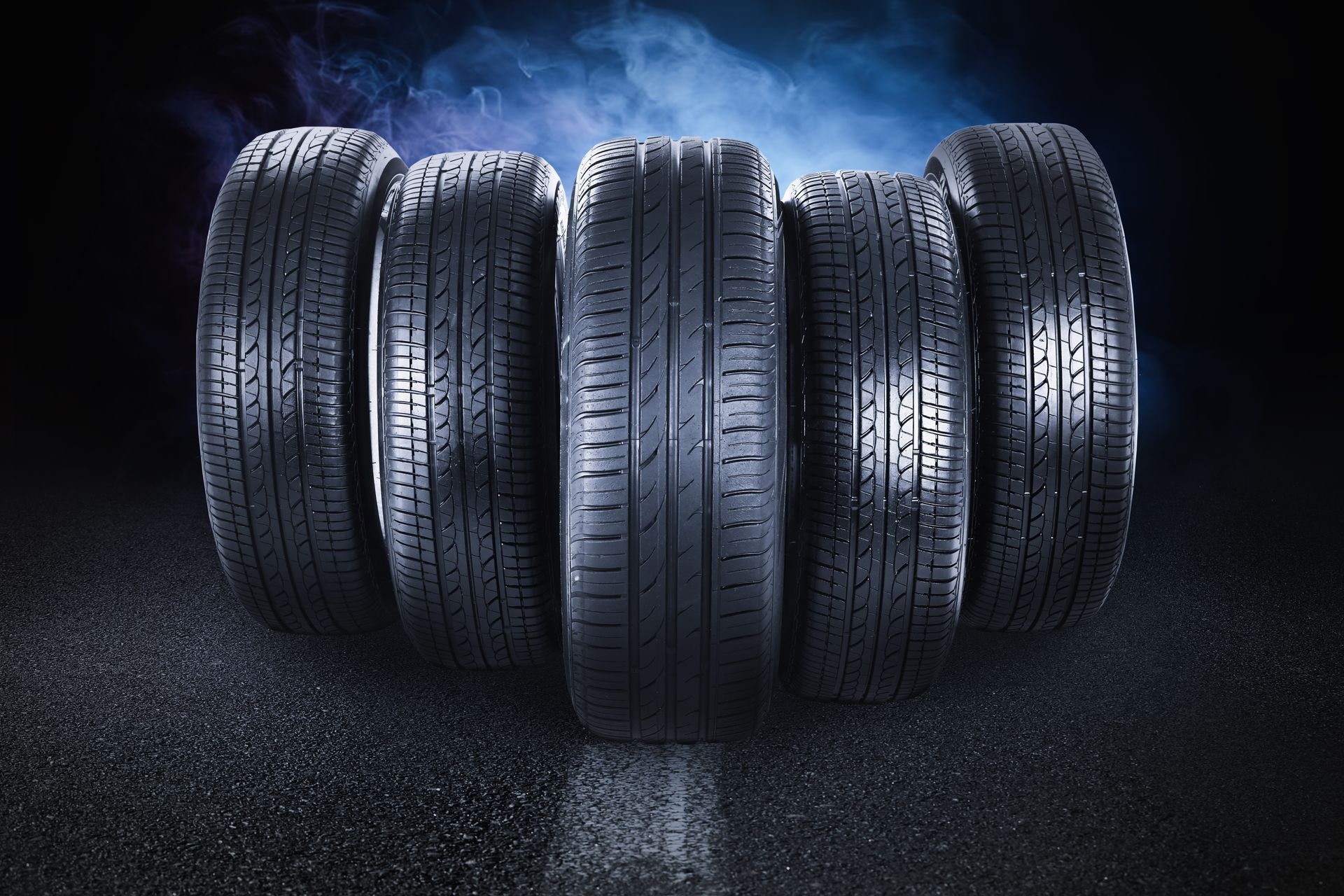 A bunch of tires are stacked on top of each other