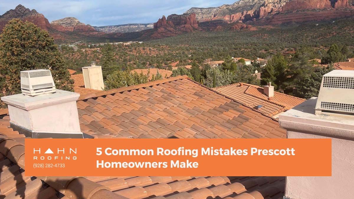 Rooftops with chimneys in Prescott, Arizona, and red rock formations in the distance. Text: 