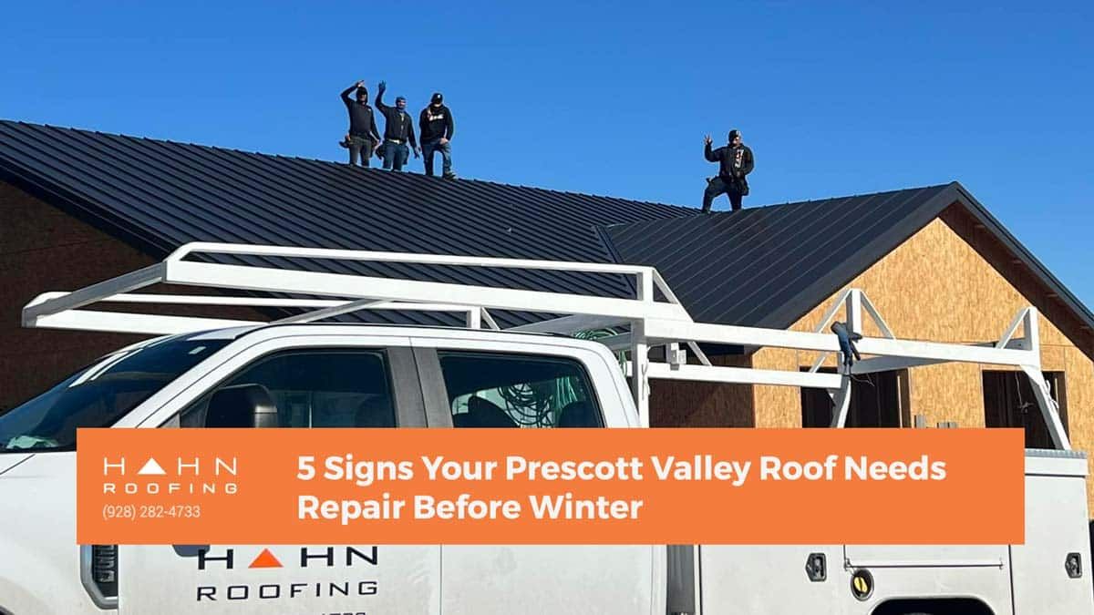 A white truck with roof racks and workers on a dark roof, text says 