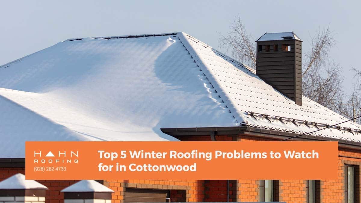 A snow-covered roof of a brick house with a chimney. Text overlay